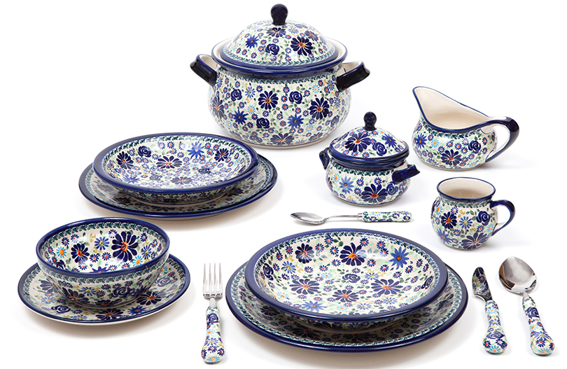 Crockery such as cups and plates in the Boleslawiec ceramic pattern DU126 arranged on a table.